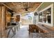 Outdoor kitchen featuring a grill, bar seating, and charming rustic details at 13199 Ash St, Thornton, CO 80241