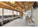 Awesome outdoor kitchen area with concrete patio, wooden beams, grill, and fence at 13199 Ash St, Thornton, CO 80241
