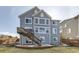 Charming home featuring a well-maintained backyard with wooden deck and stairs and beautiful blue siding at 11591 S Maiden Hair Way, Parker, CO 80134