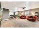 Spacious basement featuring versatile space with comfortable seating and a pool table at 11591 S Maiden Hair Way, Parker, CO 80134