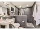 Modern bathroom with sleek tile, glass-enclosed shower, and stylish fixtures at 11591 S Maiden Hair Way, Parker, CO 80134