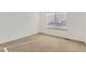 Cozy bedroom with neutral carpet and a window providing natural light at 11591 S Maiden Hair Way, Parker, CO 80134