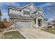 Charming two-story home with a brick-accented facade and a welcoming front porch at 11591 S Maiden Hair Way, Parker, CO 80134