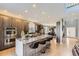 Modern kitchen with a large center island, stainless steel appliances, and sleek cabinetry at 11591 S Maiden Hair Way, Parker, CO 80134