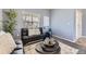 Comfortable living space featuring a sofa, stylish decor, and plenty of natural light at 11591 S Maiden Hair Way, Parker, CO 80134
