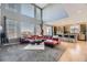 Bright, open living space with expansive windows, a modern kitchen, and stylish furnishings at 11591 S Maiden Hair Way, Parker, CO 80134