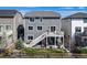 Backyard view of a multi-story home with a deck, patio, lawn, and wood fence at 17382 Bluetrail Ave, Parker, CO 80134