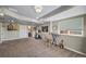 Cozy basement with natural light, exercise equipment, and stylish décor at 17382 Bluetrail Ave, Parker, CO 80134