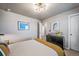 Stylish bedroom showcasing a mid-century modern cabinet and unique lighting at 17382 Bluetrail Ave, Parker, CO 80134