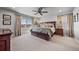 Bedroom with a large window and neutral decor at 17382 Bluetrail Ave, Parker, CO 80134