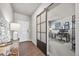 Entryway showcasing wood floors and decorative sliding glass door to office at 17382 Bluetrail Ave, Parker, CO 80134