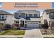 Charming two-story home featuring a two-car garage, stone accents, and a well-maintained front yard at 17382 Bluetrail Ave, Parker, CO 80134