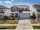 Inviting two-story home featuring a well-manicured lawn and a two-car garage at 17382 Bluetrail Ave, Parker, CO 80134