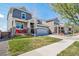 Charming two-story home featuring a well-manicured lawn, covered porch, and inviting curb appeal at 17382 Bluetrail Ave, Parker, CO 80134