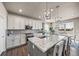 Eat-in kitchen with granite countertops, stainless appliances, and pendant lighting at 17382 Bluetrail Ave, Parker, CO 80134