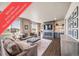 Comfortable living room with plenty of natural light and fireplace at 17382 Bluetrail Ave, Parker, CO 80134