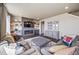 Living room with large gray sectional sofa and accent pillows at 17382 Bluetrail Ave, Parker, CO 80134