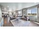 Living room with a large sectional and an open floor plan at 17382 Bluetrail Ave, Parker, CO 80134