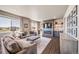 Comfortable living room featuring a large window, fireplace, and stylish furnishings at 17382 Bluetrail Ave, Parker, CO 80134