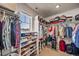 Well-organized walk-in closet with shelves, rods, and ample storage space at 17382 Bluetrail Ave, Parker, CO 80134