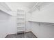 Walk-in closet with built in shelving and metal racks for organized storage space at 2275 E 129Th Ave, Thornton, CO 80241