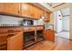 Traditional kitchen featuring wood cabinets and drawers with metal basket pullouts at 2275 E 129Th Ave, Thornton, CO 80241