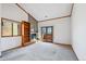 Bright living room features a cozy fireplace, built-in shelves, and sliding door to a patio at 2275 E 129Th Ave, Thornton, CO 80241