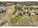 Expansive aerial view of a home with a large yard and surrounding mature trees at 19281 E Hinsdale Ln, Centennial, CO 80016