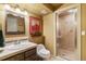 Bathroom featuring glass enclosed shower, natural light, and modern fixtures at 19281 E Hinsdale Ln, Centennial, CO 80016