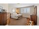 Comfortable bedroom features great natural light and neutral color palette at 19281 E Hinsdale Ln, Centennial, CO 80016