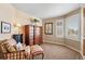 Inviting bedroom with neutral walls, plantation shutters, and classic furniture, including a comfortable chair at 19281 E Hinsdale Ln, Centennial, CO 80016