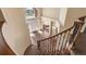 View of the home's foyer from the staircase with ample natural light at 19281 E Hinsdale Ln, Centennial, CO 80016