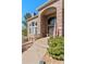 Inviting front entrance featuring a brick archway, a decorative wreath, and an American flag at 19281 E Hinsdale Ln, Centennial, CO 80016