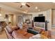 Basement living area with leather sofa, fireplace, and entertainment area at 19281 E Hinsdale Ln, Centennial, CO 80016