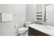 Clean bathroom with toilet, sink, and shelving at 7916 S Grand Baker Way, Aurora, CO 80016