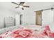 Bright bedroom with a barn door and ceiling fan at 7916 S Grand Baker Way, Aurora, CO 80016