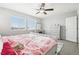 Well-lit bedroom with ample natural light and ceiling fan at 7916 S Grand Baker Way, Aurora, CO 80016