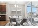 Kitchen dining area with glass table and access to back deck at 7916 S Grand Baker Way, Aurora, CO 80016