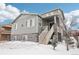 Two-story house with gray siding and stone accents, winter view at 7916 S Grand Baker Way, Aurora, CO 80016