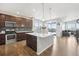 Modern kitchen with island, stainless steel appliances, and dark cabinets at 7916 S Grand Baker Way, Aurora, CO 80016