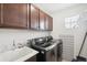 Laundry room with washer, dryer, and cabinets at 7916 S Grand Baker Way, Aurora, CO 80016