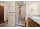 This bathroom showcases a stone tile shower and matching vanity with great design at 13012 S Wamblee Valley Rd, Conifer, CO 80433