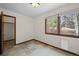 The bedroom shows slate flooring and has a window for natural light and a closet for storage at 13012 S Wamblee Valley Rd, Conifer, CO 80433