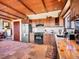 A charming kitchen boasting granite counters, wood cabinets, and stainless steel appliances at 13012 S Wamblee Valley Rd, Conifer, CO 80433