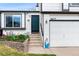 Close-up of a lovely two-story house featuring a well-manicured lawn and a convenient two-car garage at 9677 Castle Ridge Cir, Highlands Ranch, CO 80129