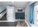 View of an entry hallway with a staircase, coat rack, and a window with natural light at 9677 Castle Ridge Cir, Highlands Ranch, CO 80129