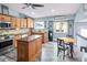Cozy kitchen features wooden cabinets, stainless steel appliances, and a central island at 9677 Castle Ridge Cir, Highlands Ranch, CO 80129