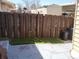 Small backyard with artificial turf and wooden fence at 1227 S Uvalda St, Aurora, CO 80012