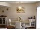 Dining area with glass table and white chairs at 1227 S Uvalda St, Aurora, CO 80012