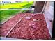 Landscaped front yard with mulch and flowers at 1227 S Uvalda St, Aurora, CO 80012